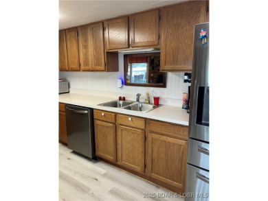 ***Huge PRICE REDUCTION*** Rare find *Level* Lakefront home sits