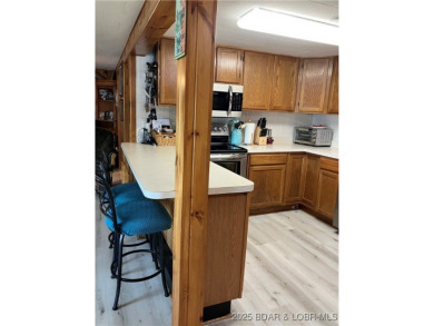 ***Huge PRICE REDUCTION*** Rare find *Level* Lakefront home sits