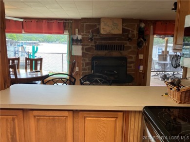 ***Huge PRICE REDUCTION*** Rare find *Level* Lakefront home sits