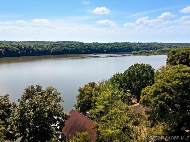 Turnkey lakefront getaway on the 80 MM! This beautiful home