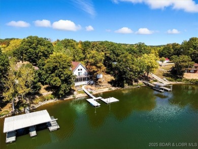 Turnkey lakefront getaway on the 80 MM! This beautiful home