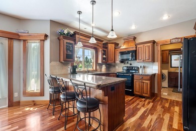 Nestled near the Greenbelt and Snake River, this meticulously