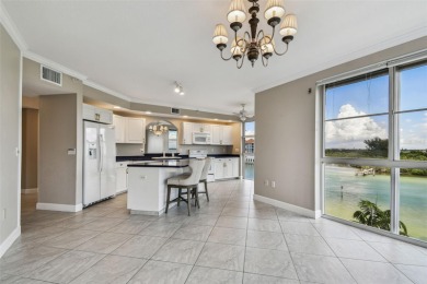 Enjoy luxury waterfront living in this premier fourth floor end