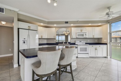 Enjoy luxury waterfront living in this premier fourth floor end