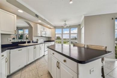 Enjoy luxury waterfront living in this premier fourth floor end