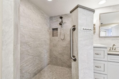 Enjoy luxury waterfront living in this premier fourth floor end