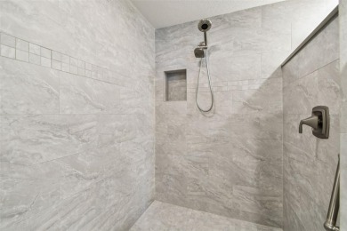 Enjoy luxury waterfront living in this premier fourth floor end