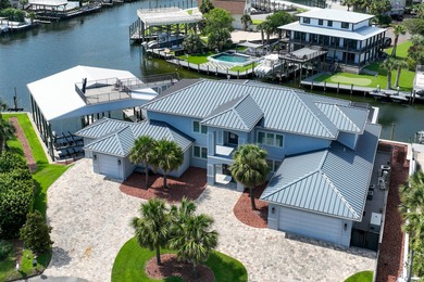 This canal-front home on Holiday Isle sits on a spacious corner