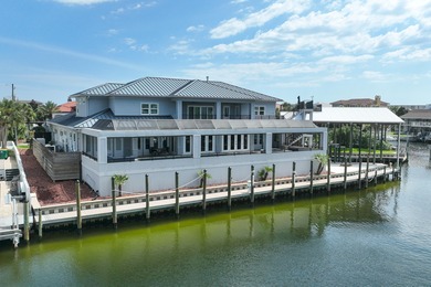This canal-front home on Holiday Isle sits on a spacious corner