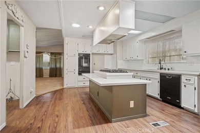 Spacious and inviting triple-wide home in a welcoming 55+