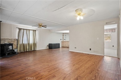 Spacious and inviting triple-wide home in a welcoming 55+