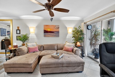 Welcome to waterfront living at sun-swept Unit 203 in