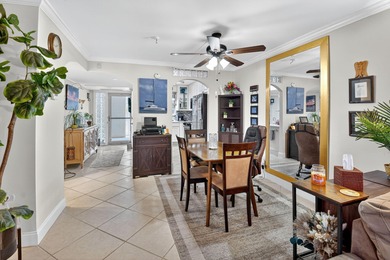 Welcome to waterfront living at sun-swept Unit 203 in