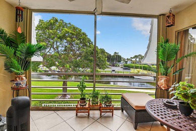 Welcome to waterfront living at sun-swept Unit 203 in