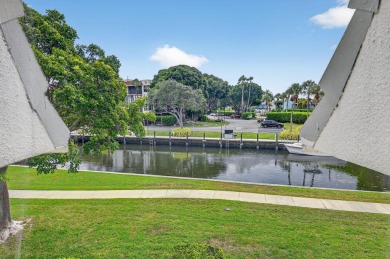 Welcome to waterfront living at sun-swept Unit 203 in