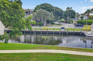 Welcome to waterfront living at sun-swept Unit 203 in