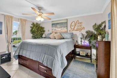 Welcome to waterfront living at sun-swept Unit 203 in