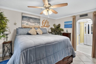 Welcome to waterfront living at sun-swept Unit 203 in