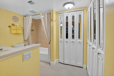 Welcome to waterfront living at sun-swept Unit 203 in