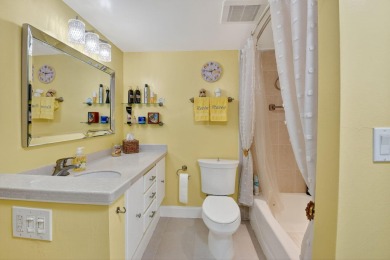 Welcome to waterfront living at sun-swept Unit 203 in