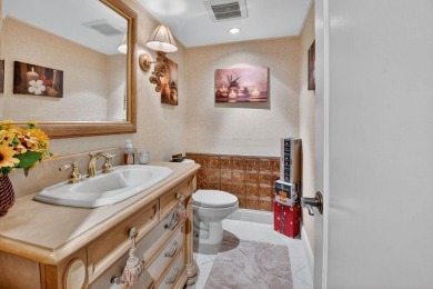 Welcome to waterfront living at sun-swept Unit 203 in