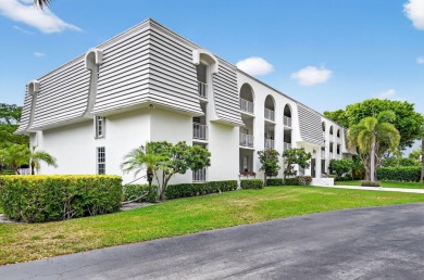 Welcome to waterfront living at sun-swept Unit 203 in