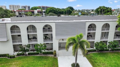 Welcome to waterfront living at sun-swept Unit 203 in