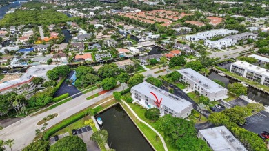 Welcome to waterfront living at sun-swept Unit 203 in