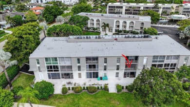 Welcome to waterfront living at sun-swept Unit 203 in