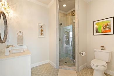 Tucked behind the gates of Sea Shell Shores, lies a home of