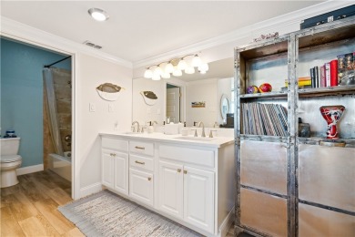 Tucked behind the gates of Sea Shell Shores, lies a home of