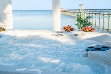 Tucked behind the gates of Sea Shell Shores, lies a home of