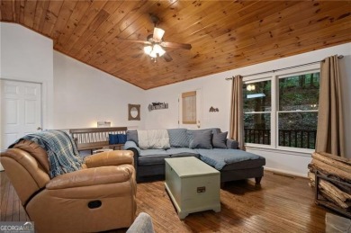 THIS CHARMING COTTAGE HOME WITH HARDIBOARD EXTERIOR SIDING