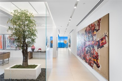 FULL-FLOOR DESIGNER OCEANFRONT LOWER PENTHOUSE WITH UNOBSTRUCTED