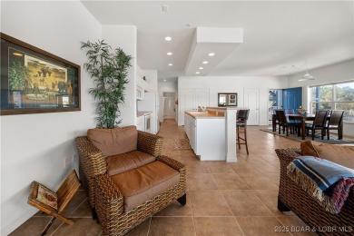 Experience lake living at its finest with this beautifully