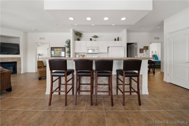 Experience lake living at its finest with this beautifully