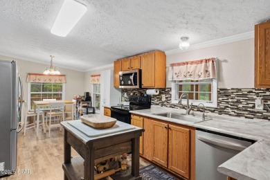 Nestled at the end of a quiet paved cul-de-sac, this spacious