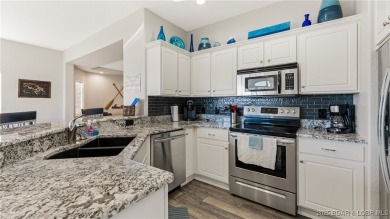 Enjoy incredible lake views from this spacious 4-bedroom, 3-bath