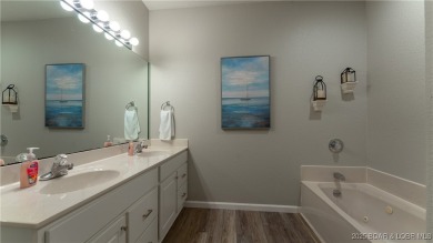 Enjoy incredible lake views from this spacious 4-bedroom, 3-bath