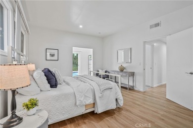 Enjoy coastal living in this inviting pool home with ocean views