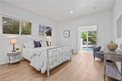 Enjoy coastal living in this inviting pool home with ocean views