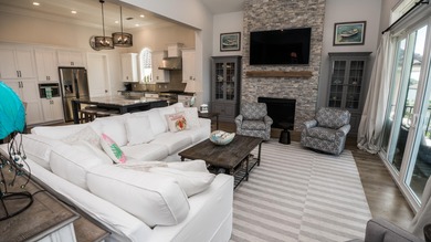 This beautifully designed home located in the exclusive gated