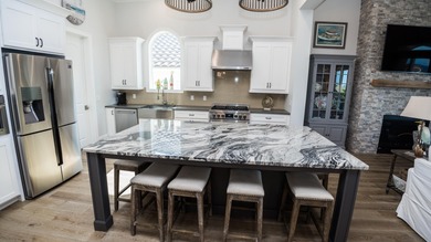 This beautifully designed home located in the exclusive gated