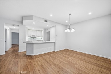 Welcome to this beautifully updated and light-filled end unit in