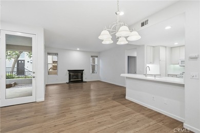 Welcome to this beautifully updated and light-filled end unit in