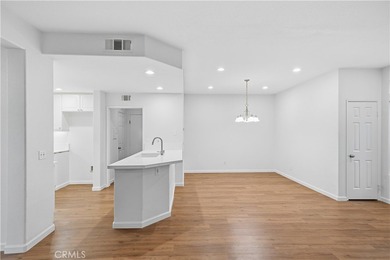 Welcome to this beautifully updated and light-filled end unit in