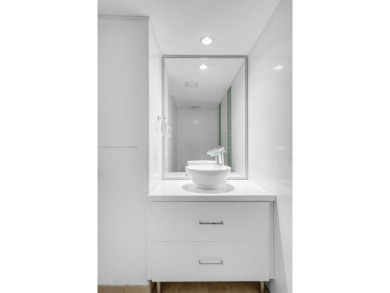 Timeless oceanfront residence in the heart of Mid-Beach. Wake up