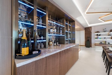 This elegantly designed 4-bedroom, 4.5-bath residence at Palazzo