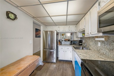 Welcome to Deerfield Beach Gardens! This 3rd-floor, beautifully