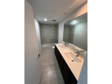 Experience elevated waterfront living in this chic 2-bed, 2